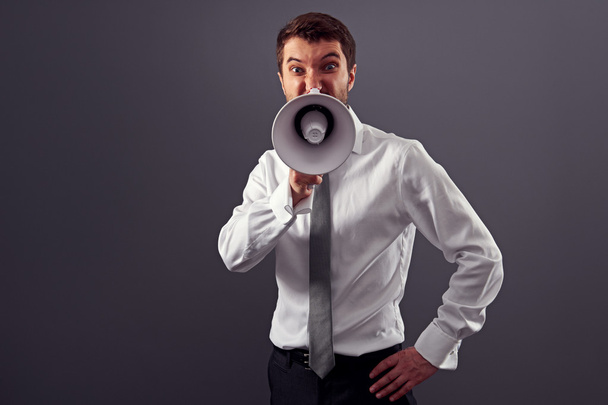 young businessman screaming in megaphone - Photo, Image