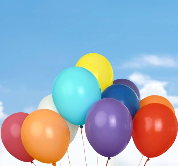 Bunch of bright balloons on sky  background - Foto, imagen