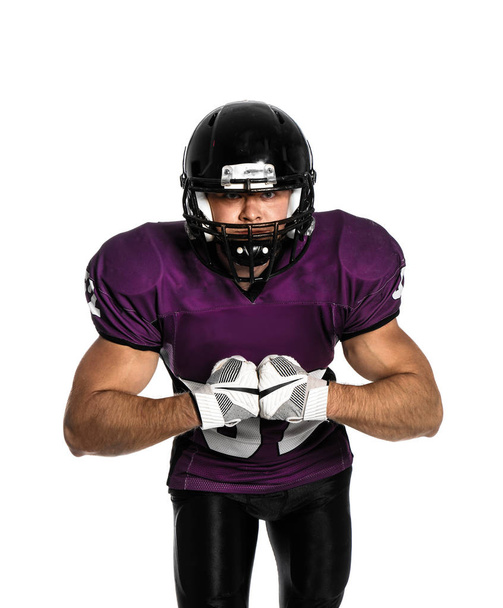 American football player wearing uniform on white background - Foto, afbeelding