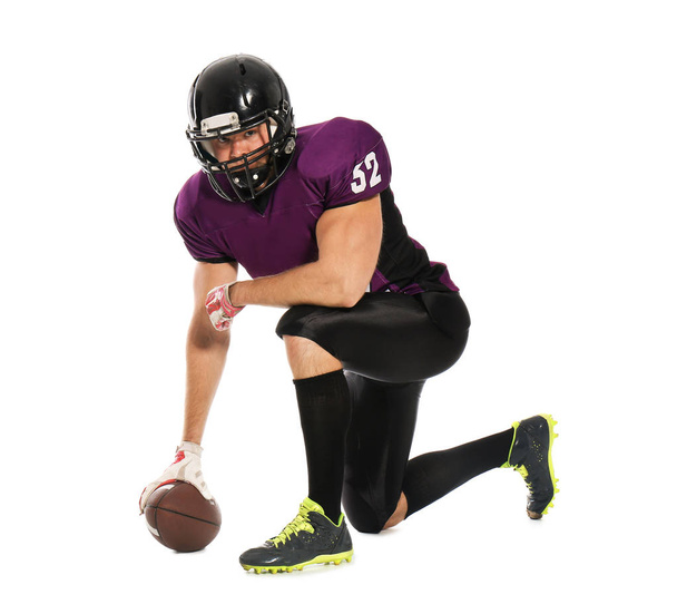 American football player with ball on white background - 写真・画像