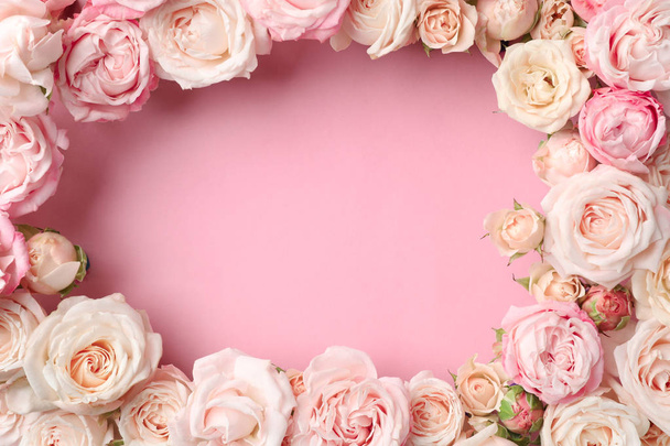 Flat lay composition with beautiful roses and space for text on color background - Photo, image