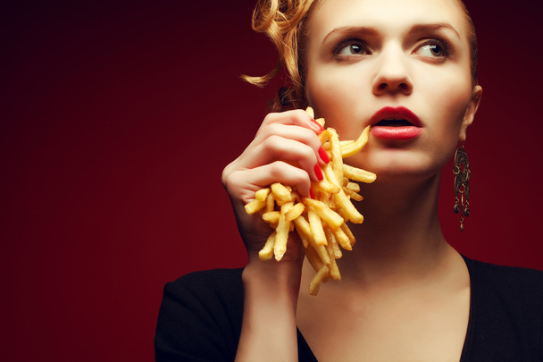 Unhealthy eating. Junk food concept. Portrait of fashionable you - Zdjęcie, obraz