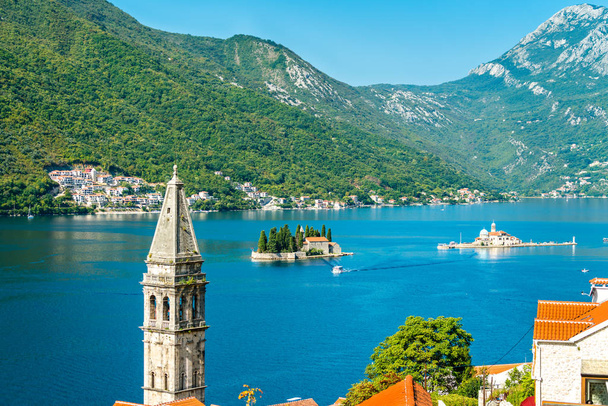 View of the Bay of Kotor with two small islands and a bell tower in Perast, Montenegro - Photo, Image