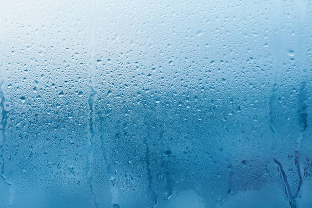 Condensación en la ventana de cristal transparente. Gotas de agua. Lluvia. Textura de fondo abstracta
 - Foto, Imagen
