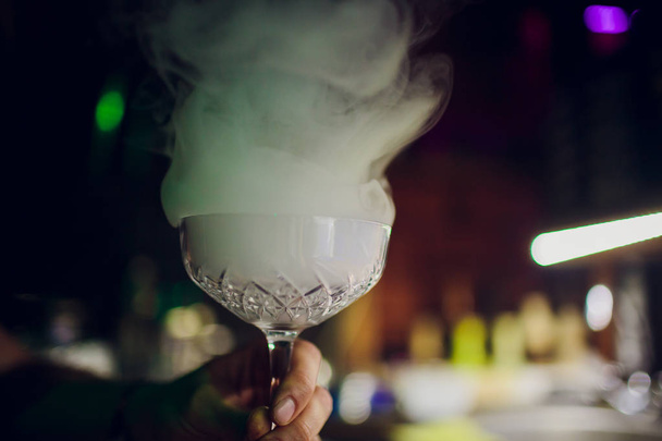 drink in glass with effect dry ice - Foto, Imagem