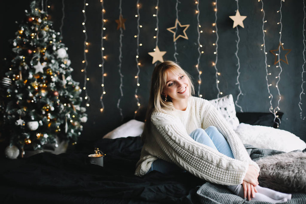 New Year portrait of a girl in festive interior. Christmas and  New Year concept. Happy New Year 2019 - Fotografie, Obrázek