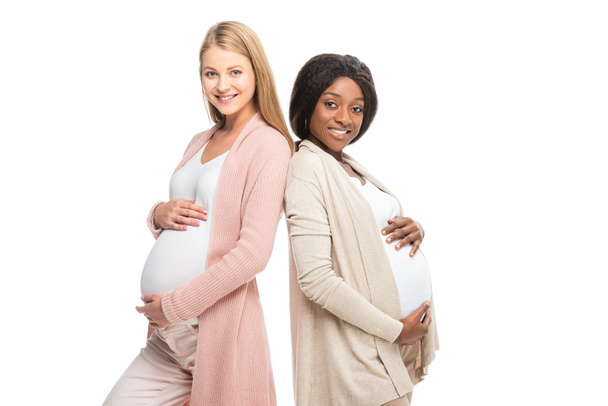 multicultural smiling pregnant women looking at camera isolated on white - Photo, Image