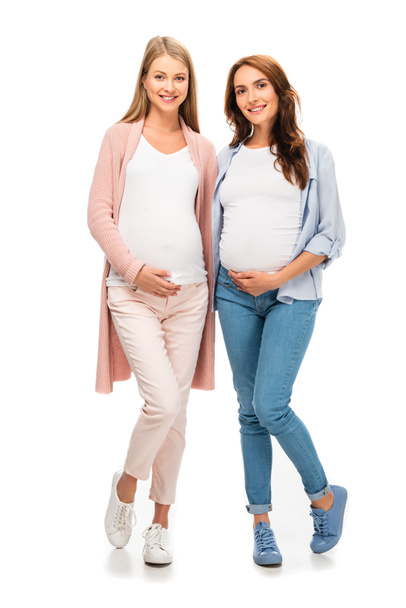 two pregnant women standing and smiling isolated on white - Photo, Image