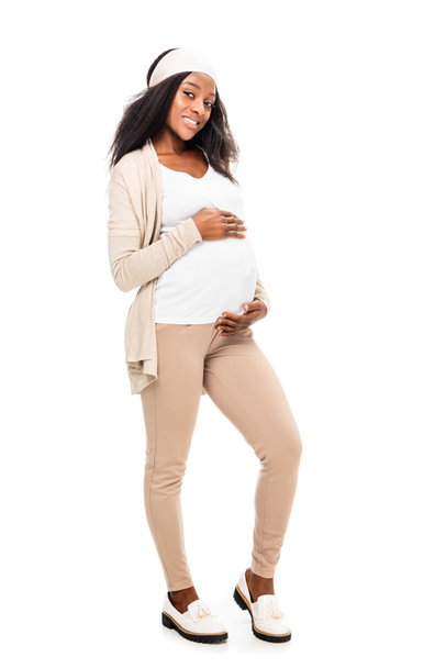 african american pregnant woman holding hands on belly isolated on white - Foto, imagen