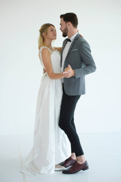 Couples who are getting married are happy when they try to get married at the studio. - Foto, immagini