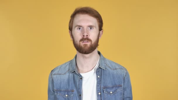 Surprised Redhead Man in Shock Isolated on Yellow Background, wondering - Footage, Video