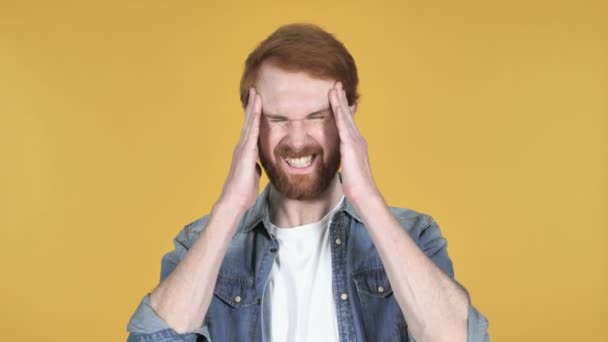 Redhead Man with Headache Isolated on Yellow Background - Felvétel, videó