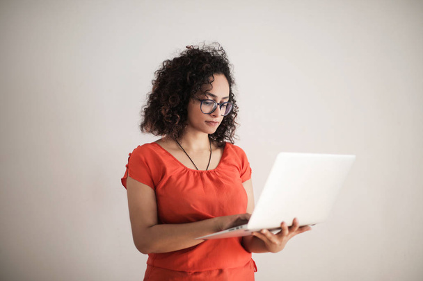 black woman with laptop - Фото, изображение