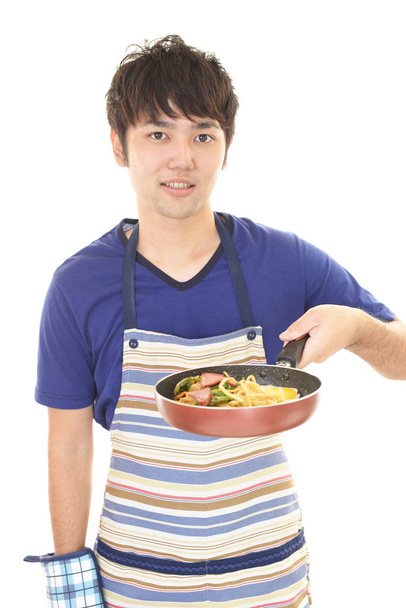 Asian man cooking healthy food - Photo, Image