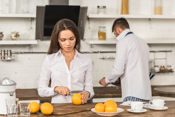 boyfriend and girlfriend preparing breakfast on weekday, gender equality concept - Photo, Image