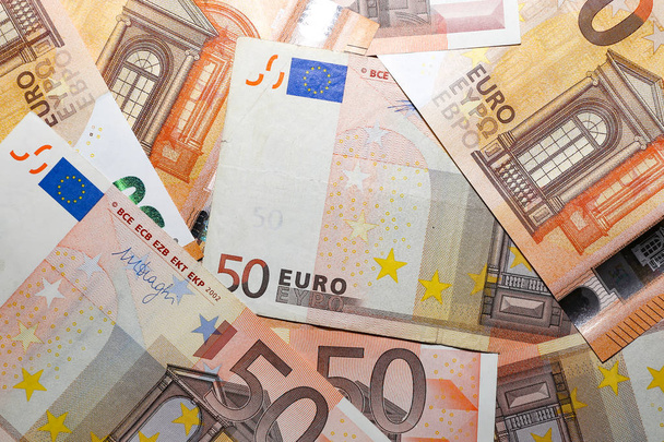 Stapel papieren eurobankbiljetten als achtergrond - Foto, afbeelding