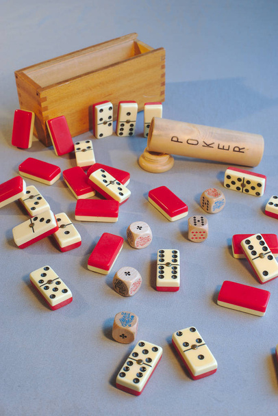 Ancient domino and dice poker games, pell-mell on a table - Photo, Image