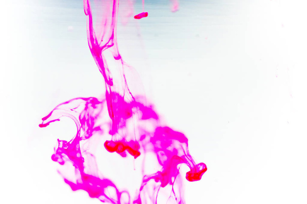 a drop of paint pouring in water - Foto, Imagen