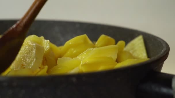 fry potatoes in a pan - Felvétel, videó