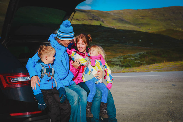 happy family kids travel by car on road in nature - Photo, Image