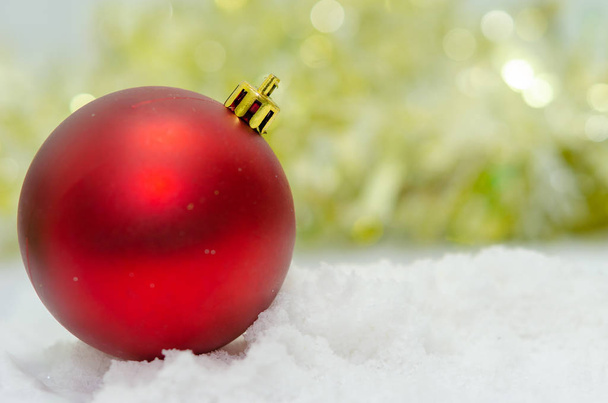 Red ball on snow.Blur abstract background - Photo, image