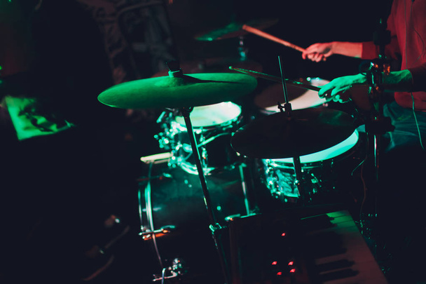 Modern drum set shot in smoky dark studio. - Φωτογραφία, εικόνα
