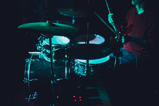 Modern drum set shot in smoky dark studio. - Foto, imagen