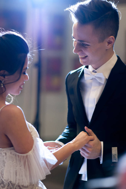 newlyweds hold hands on their wedding day on their wedding day - Photo, image