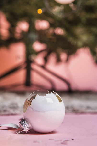 close up view of broken christmas ball on pink backdrop - Photo, Image