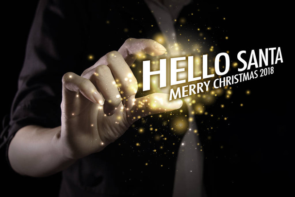 Käsi näyttää Hello Joulupukille. Toivotan teille ihania muistoja tänä iloisena kautena. - Valokuva, kuva