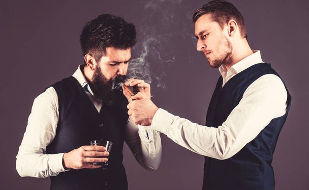 Friend, business partner, assistant helping man with beard light cigar. - Fotó, kép