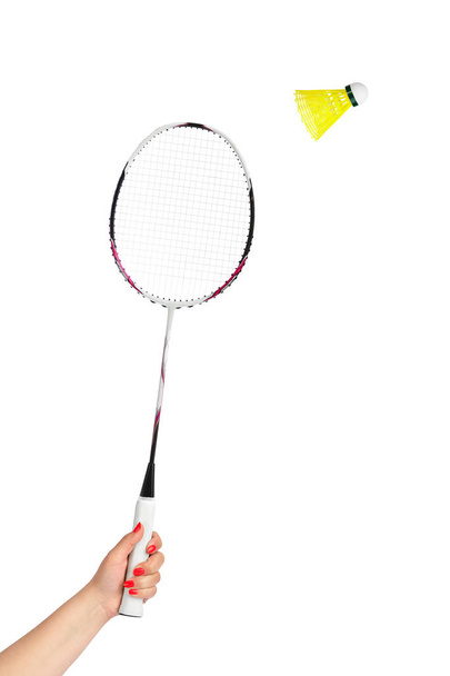 Hand with badminton racket and shuttlecock isolated on white background - Φωτογραφία, εικόνα