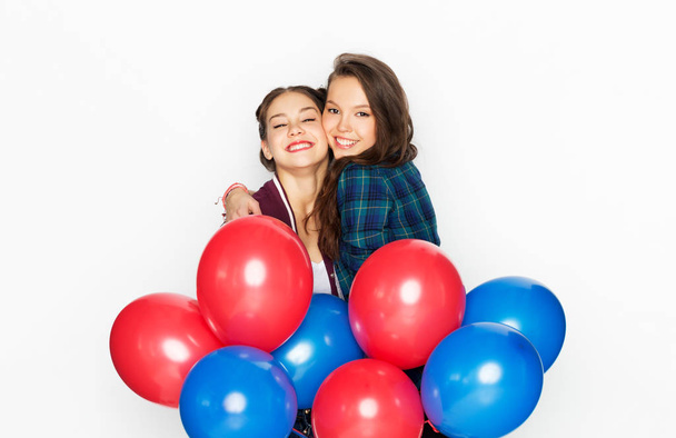 happy teenage girls with helium balloons - Photo, Image