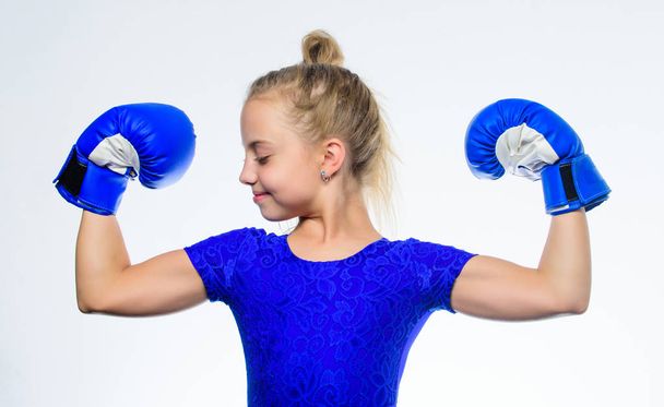 Upbringing for leadership and winner. Strong child boxing. Sport and health concept. Boxing sport for female. Be strong. Girl child with blue gloves posing on white background. Sport upbringing - Zdjęcie, obraz