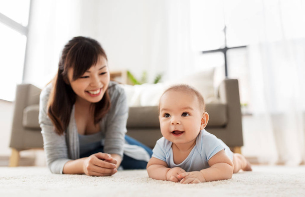 sweet little asian baby boy with mother at home - Fotografie, Obrázek