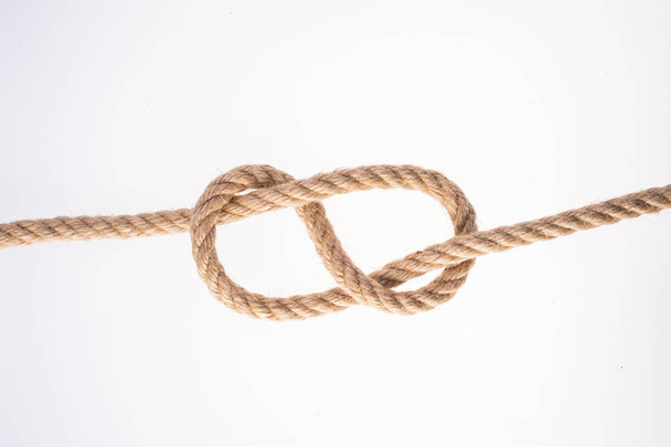 Figure Eight knot on white background. Rope node - Фото, изображение