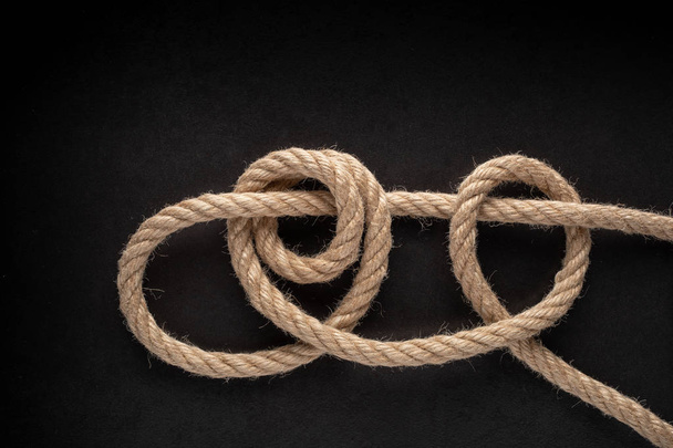 Taut-Line Hitch Knot on black background. Rope node. - Photo, Image