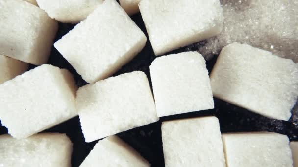 The rotation of the sugar cubes and crystal sugar top view - Footage, Video