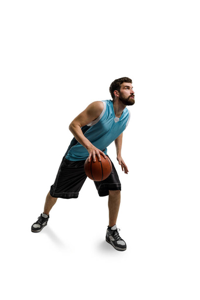 Driving basketball player on white - Foto, afbeelding