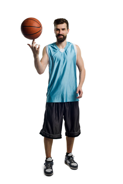 Basketball player spinning a ball - Фото, изображение
