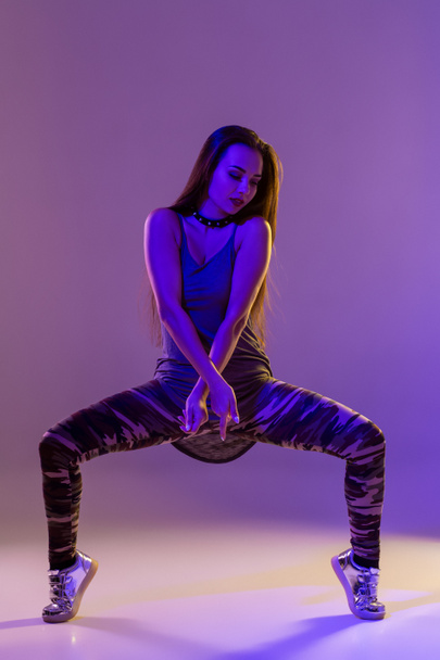 Modern style dancer posing on studio background. Color filters - Foto, Imagem