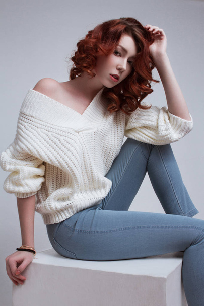 beautiful girl in a sweater - Фото, изображение