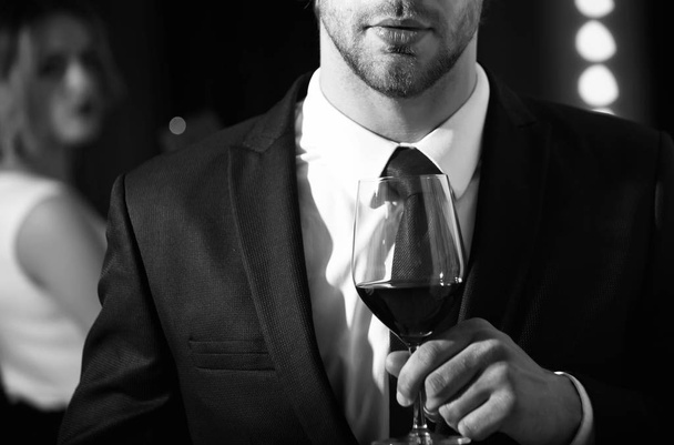 relax with glass of wine in hand of man - Φωτογραφία, εικόνα