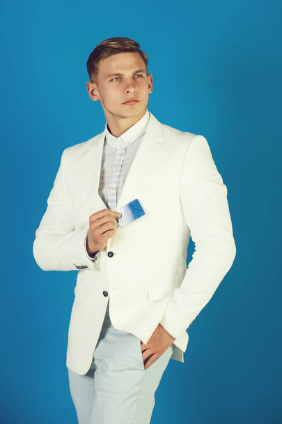 Manager wearing casual suit on blue background - Photo, image