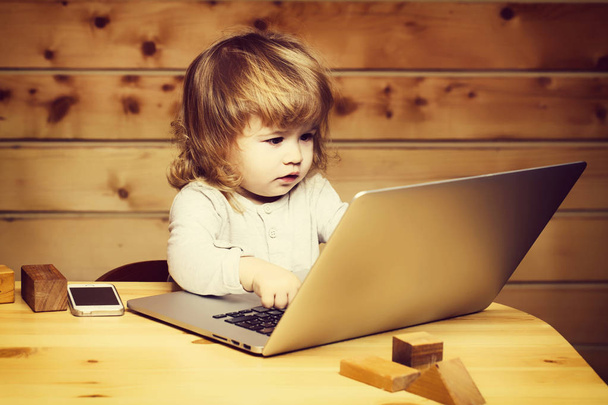 Small boy with computer and phone - Zdjęcie, obraz