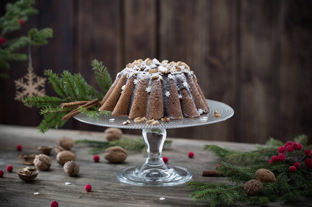 Christmas cake on dark wooden background - Fotografie, Obrázek