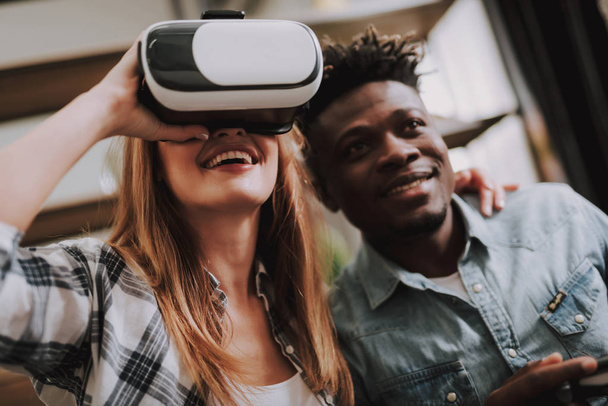 Joyful friends playing video games and using VR headset - Foto, Bild