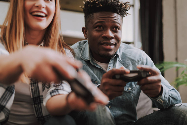 Joyful afro american guy playing video games with friend - Zdjęcie, obraz