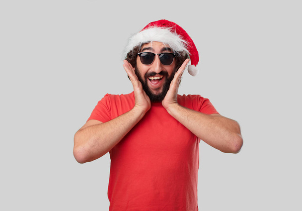 Young crazy man is gesticulating. Christmas concept. - Foto, Bild