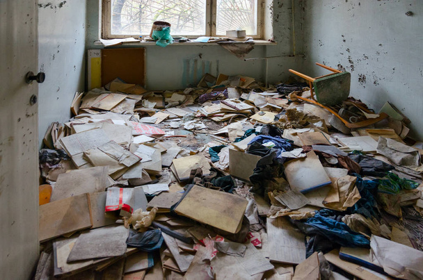 Medical documentation on floor in hospital No. 126, dead abandoned ghost town Pripyat in Chernobyl alienation zone, Ukraine - Foto, imagen